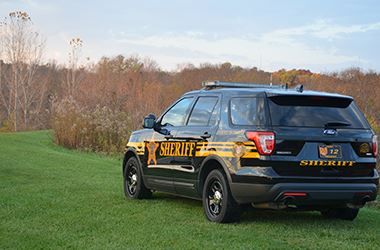 Sheriff vehicle in the Grass